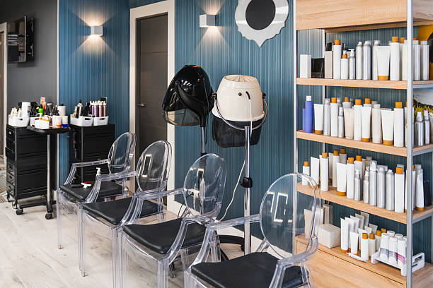 istock Empty modern hairdressing salon interior with styling chairs 2239627958