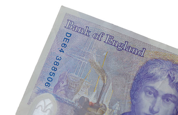 Close-up fragments of British 20 pound banknote with macro details.