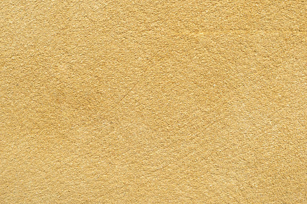 istock Textured background of smooth yellow surface perfect for design projects, wallpapers, or artistic compositions 2239633946