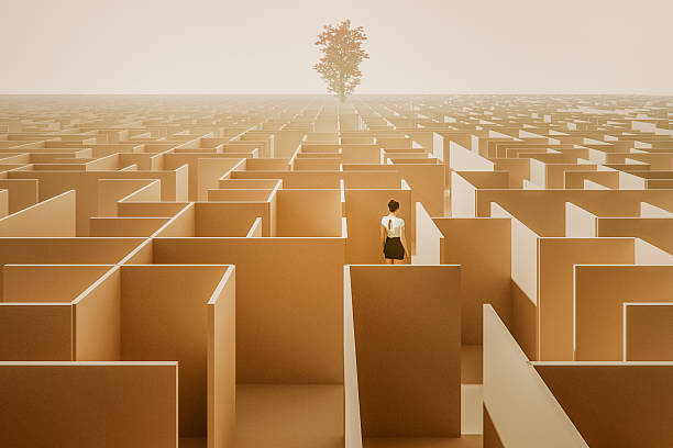 istock Woman standing in surreal maze 2239638201