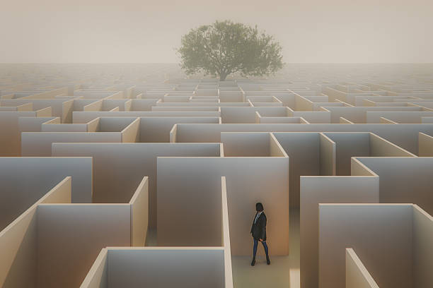 istock Woman standing in surreal maze 2239638211