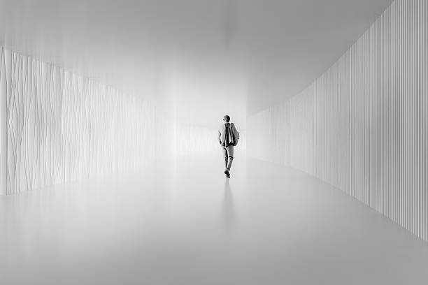 istock Businessman walking in corridor 2239638849
