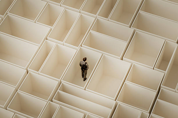 istock Young  businessman standing in VR maze 2239639128