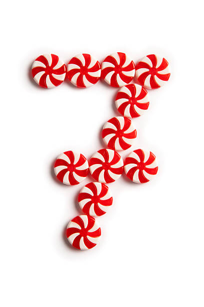 Number 7 made of candies isolated on white background