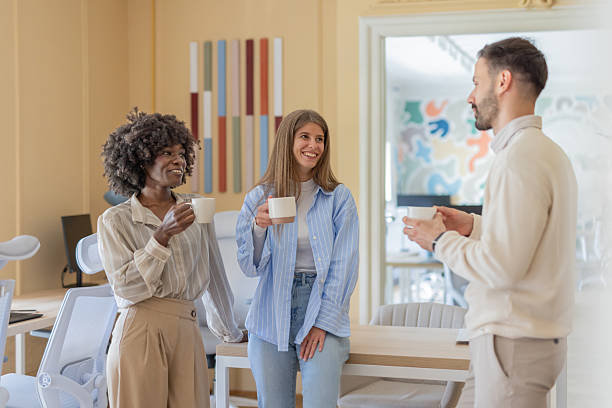 istock Team members enjoying a casual chat during office break 2239648154