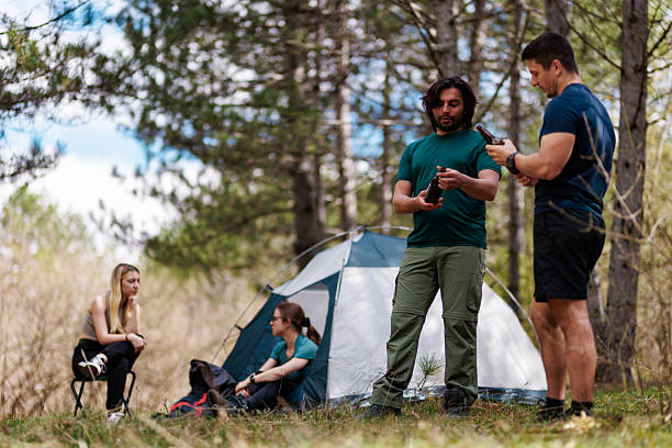 istock Camping trip with friends in a serene forest setting focusing on bonding and relaxation under clear skies 2239648442