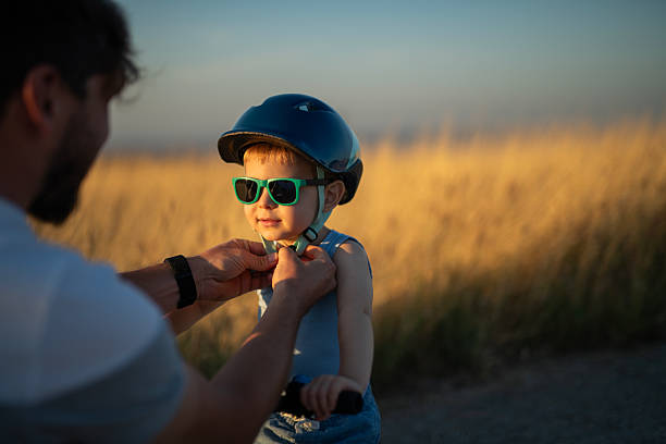 istock Safety first during bike riding lessons with dad. 2239648557