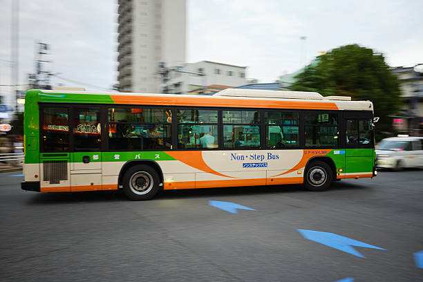 Tokyo, Japan - October 6, 2025: A Toei non-step bus passing through an intersection in Ojima City, Koto Ward, Tokyo Japan.