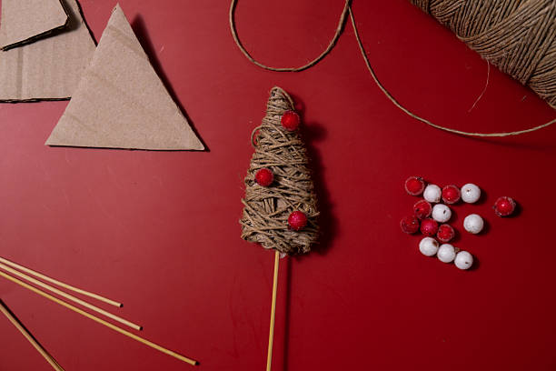 istock Rope Christmas tree Gift Christmas idea. Do it yourself instruction eco-friendly decoration. Making handmade presents children's diy projects. Holiday family time 2239653875