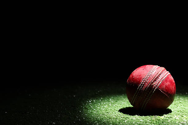 istock Cricket ball in Spot Light with Black Background 2239659737