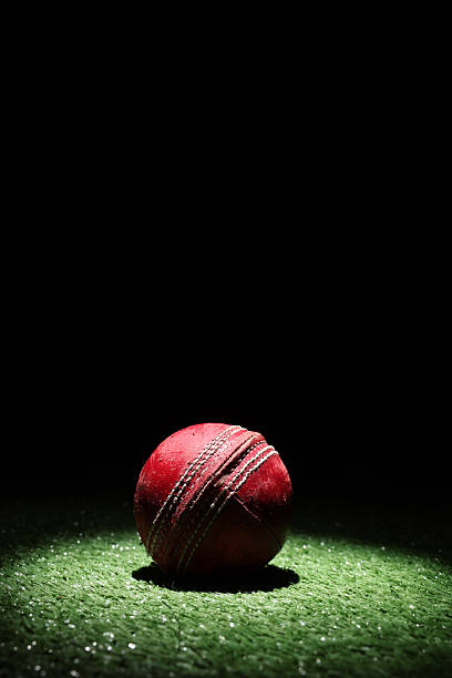 istock Cricket ball in Spot Light with Black Background 2239659739