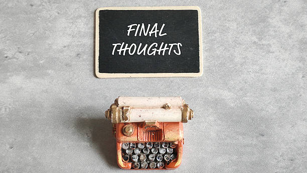 istock Final Thoughts White Text on Black Chalkboard with Miniature Vintage Typewriter Below 2239660811