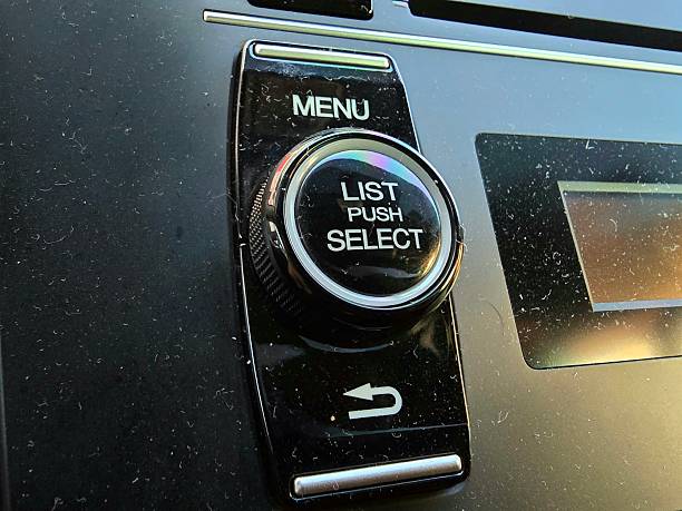 istock Close-up of a car control knob with “LIST PUSH SELECT” text on a modern vehicle dashboard. Automotive multimedia system button detail representing technology and design in car interiors 2239662036