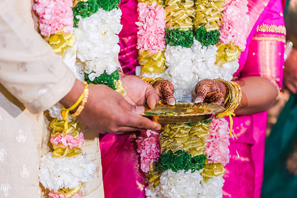 istock Indian traditional wedding ceremony ritual items and hands close up 2239662942
