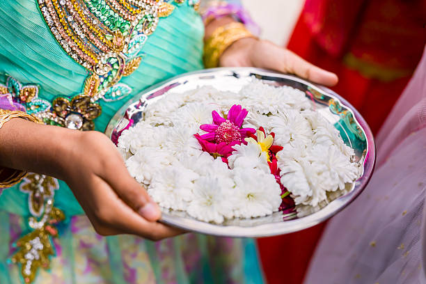 istock Indian traditional wedding ceremony ritual items and hands close up 2239662962
