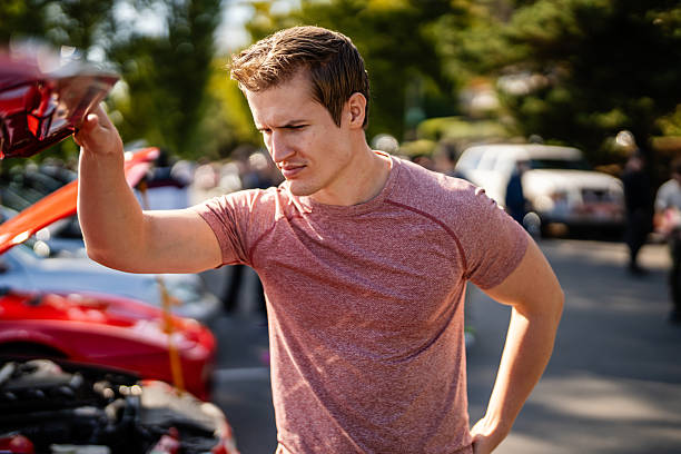 istock Man Standing by Muscle Car at Meetup 2239664237