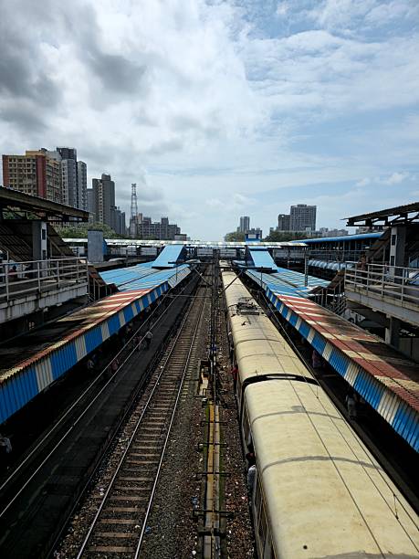 istock Local train passing though station elevated view located in rural India. The shot is taking from the bridge. 2239664383