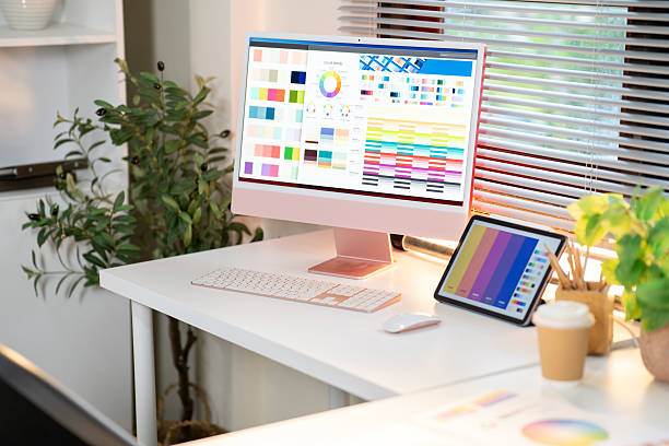 istock Computer screen and tablet displaying color charts or palette on working table in designer's office. 2239667111