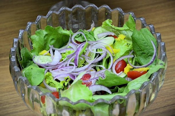 istock Salad with lettuce, arugula, red onion, cherry tomatoes, cucumber and mango 2239669020