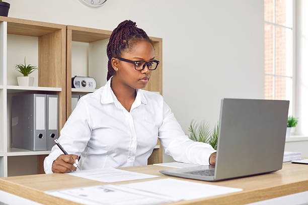 istock Focused African American girl working on laptop PC 2239670945