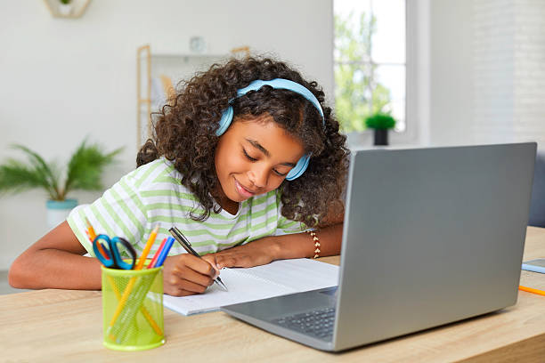 istock Remote Education. Happy schoolgirl doing homework together. 2239676218