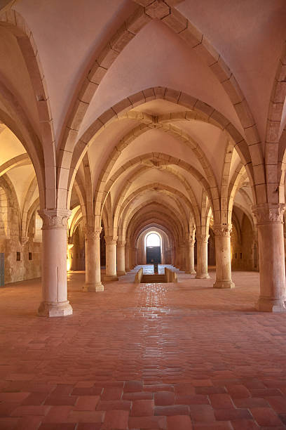 istock Gothic novice dormitory at Alcobaca Monastery with stone columns and a high vault in a historic Portuguese setting 2239680570