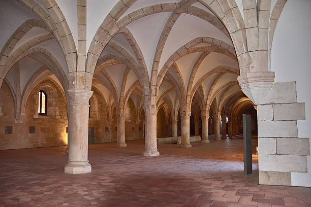 istock Gothic novice dormitory at Alcobaca Monastery with stone columns and a high vault in a historic Portuguese setting 2239680571