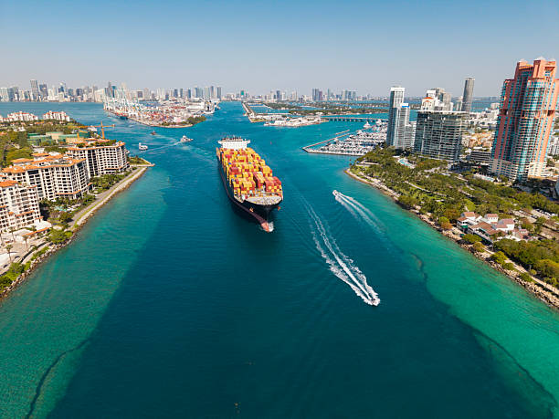 istock Aerial cargo ship with container. Cargo business. Container ship. Shipping logistics. Commercial shipping. Cargo ship in sea, aerial view. Freight container loaded on cargo vessel. Ship route 2239684767