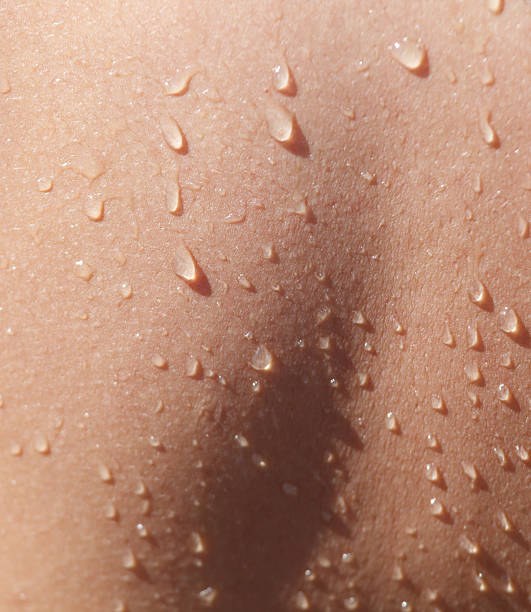 istock A person's back is wet with water 2239685271