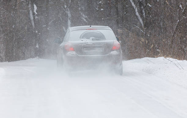 istock A car is driving on a snowy road 2239685473