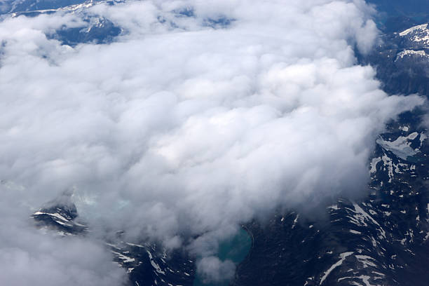 View from plane on mountains and clouds, Norway