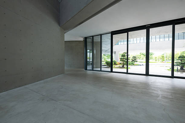 istock Open indoor three-dimensional space, glass sliding doors with concrete grey walls 2239686736