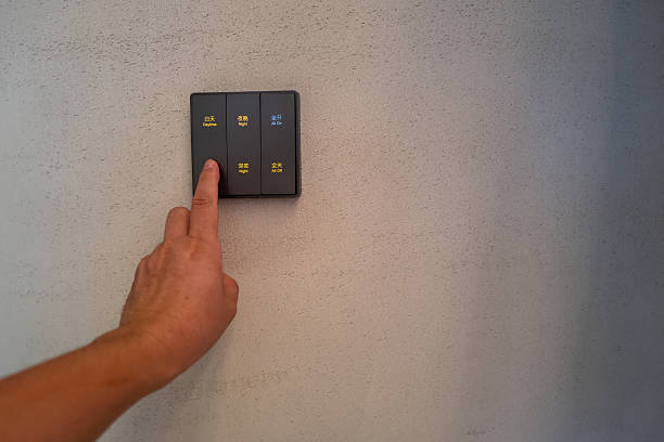 istock Press the switch on the wall with your hand to turn on the lights 2239687153