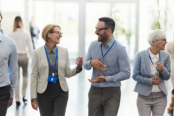 istock Happy entrepreneurs talking on the move in a hallway. 2239687658