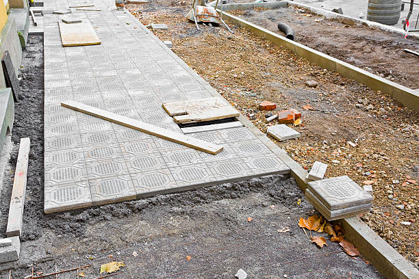 istock Construction site with resurfacing of a sidewalk in concrete tiles 2239688554