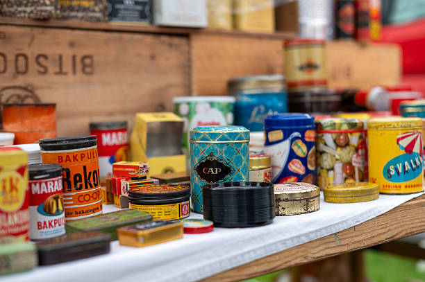 A collection of tin cans at an antique market, or a flea market, in Nora.