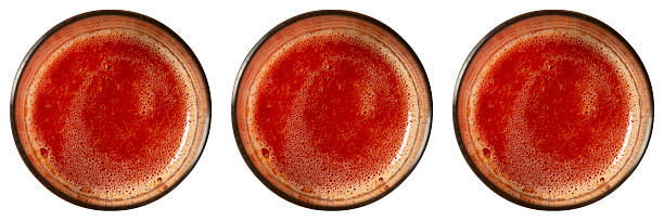 istock Tomato juice in glass isolated on white 2239696384