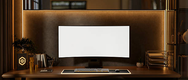 istock White screen computer with gold coins and award plate aside calculator on table with backlighting. 2239697098