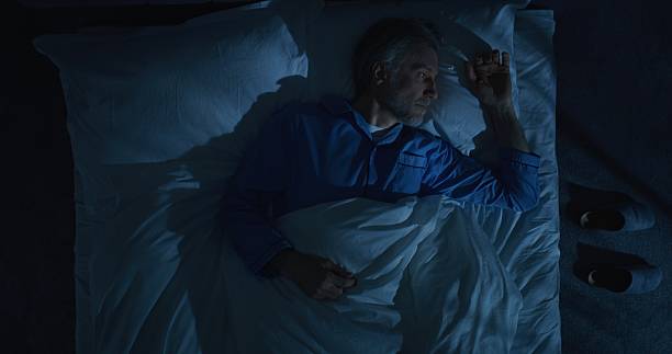 istock At Night, Man With Gray Hair Cannot Sleep Due Multitude of Thoughts After Difficult Day 2239704522