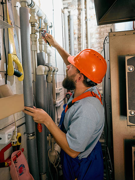 istock Technician repairing heating pipes in technical room 2239705706