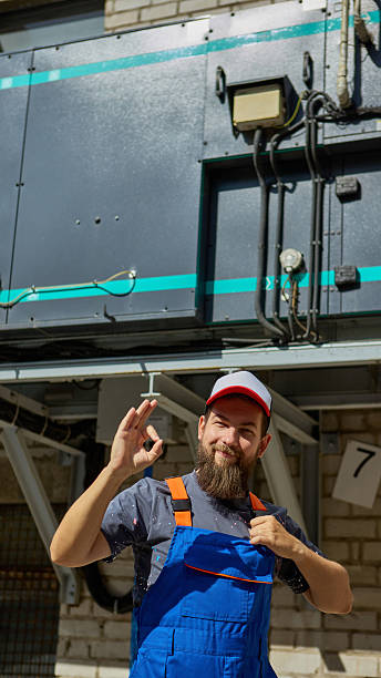 istock Engineer showing okay gesture near industrial equipment ensuring reliability 2239705750