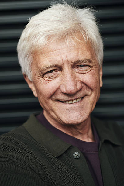 istock Portrait of Senior Man Smiling While Looking Directly at Camera 2239705771