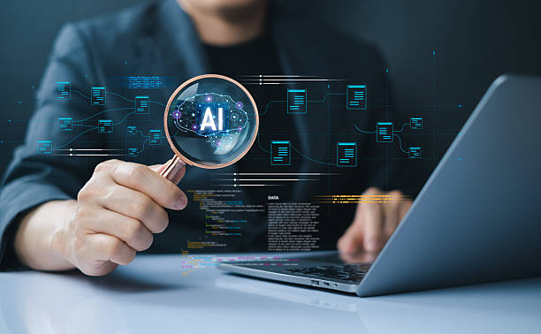 istock Businessman working with AI chip, analyzing data through magnifying glass on laptop screen to study artificial intelligence performance and digital analytics. 2239707112