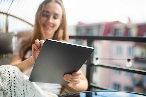istock Young woman with digital tablet 2239709019