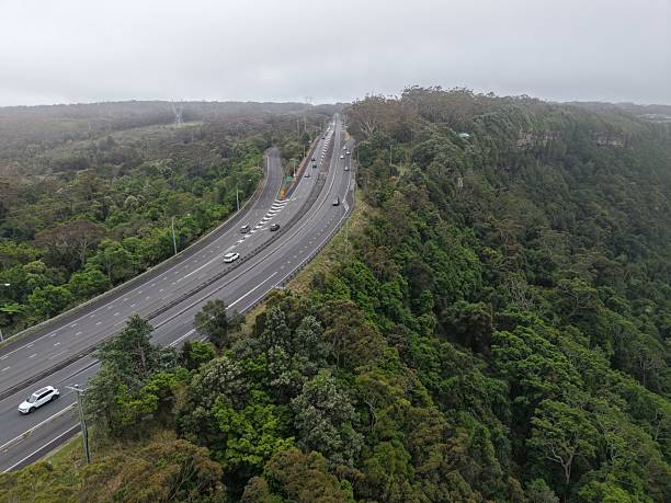 istock Wollongong highway and coastal cliffs under clouds and rain, captured with a drone 2239710456