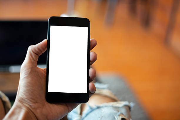 istock mock up man hand using smartphone In the coffee shop,Screen blank with clipping path 2239710773