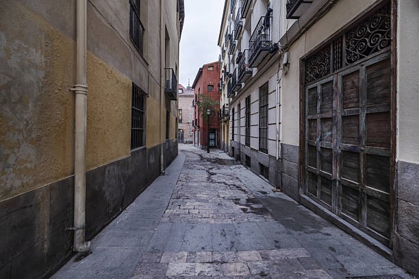 istock A narrow pedestrian street with stone pavement between 2239711181