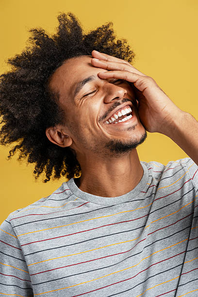 istock Young Black man laughing with hand on forehead 2239716508