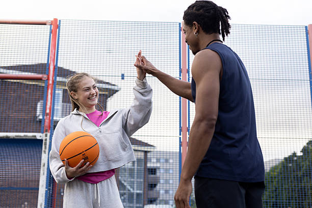 istock High Fiving with Basketball Instructor 2239717885