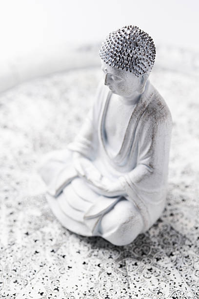 istock Meditating Buddha Statue on bright background. Soft focus. Copy space. 2239718360